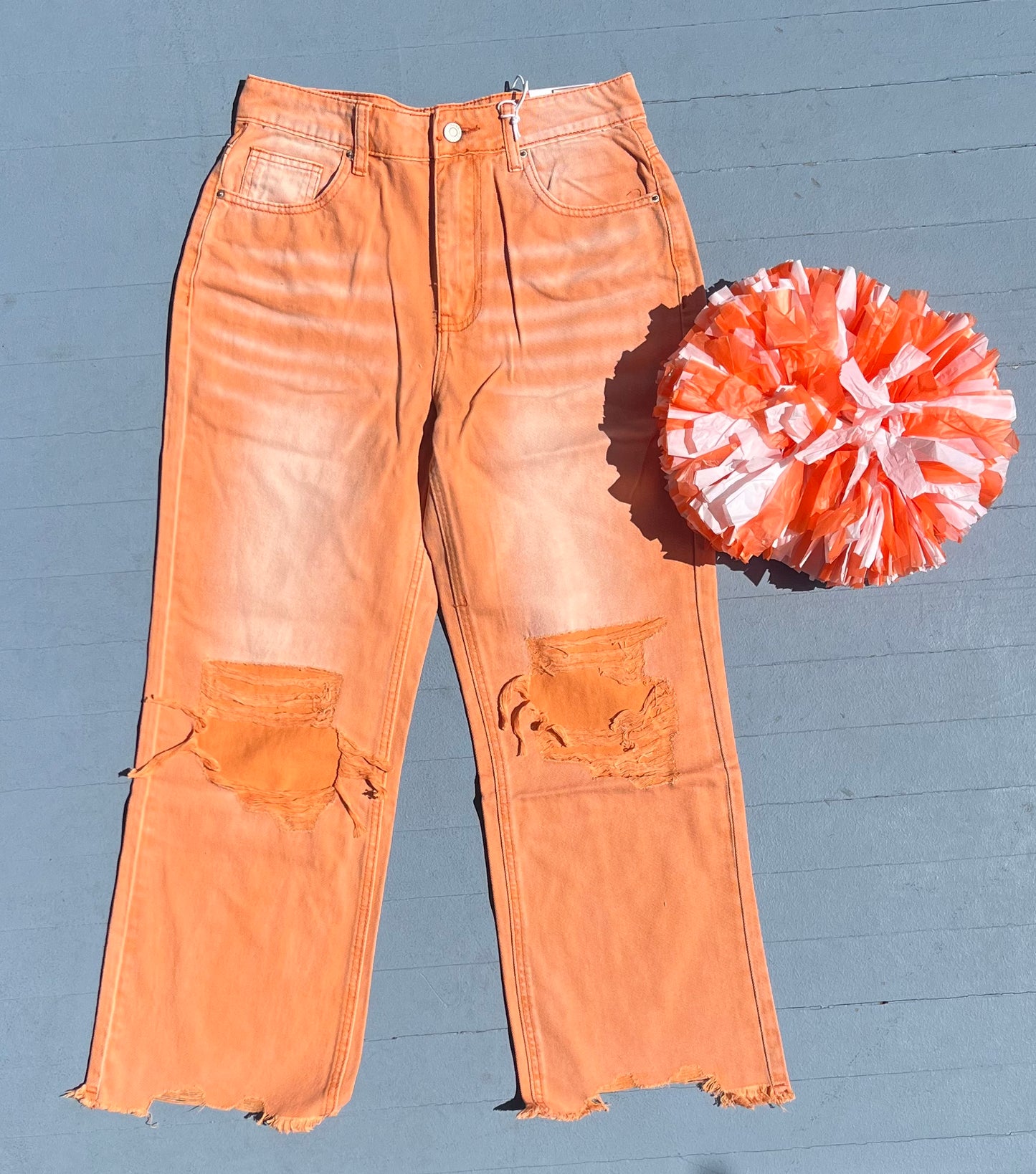 Orange distressed denim pants