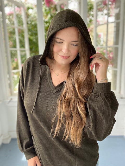 Long sleeved hooded green top
