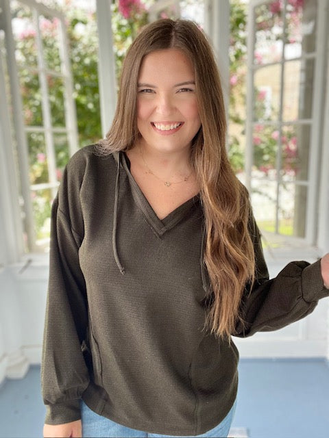 Long sleeved hooded green top