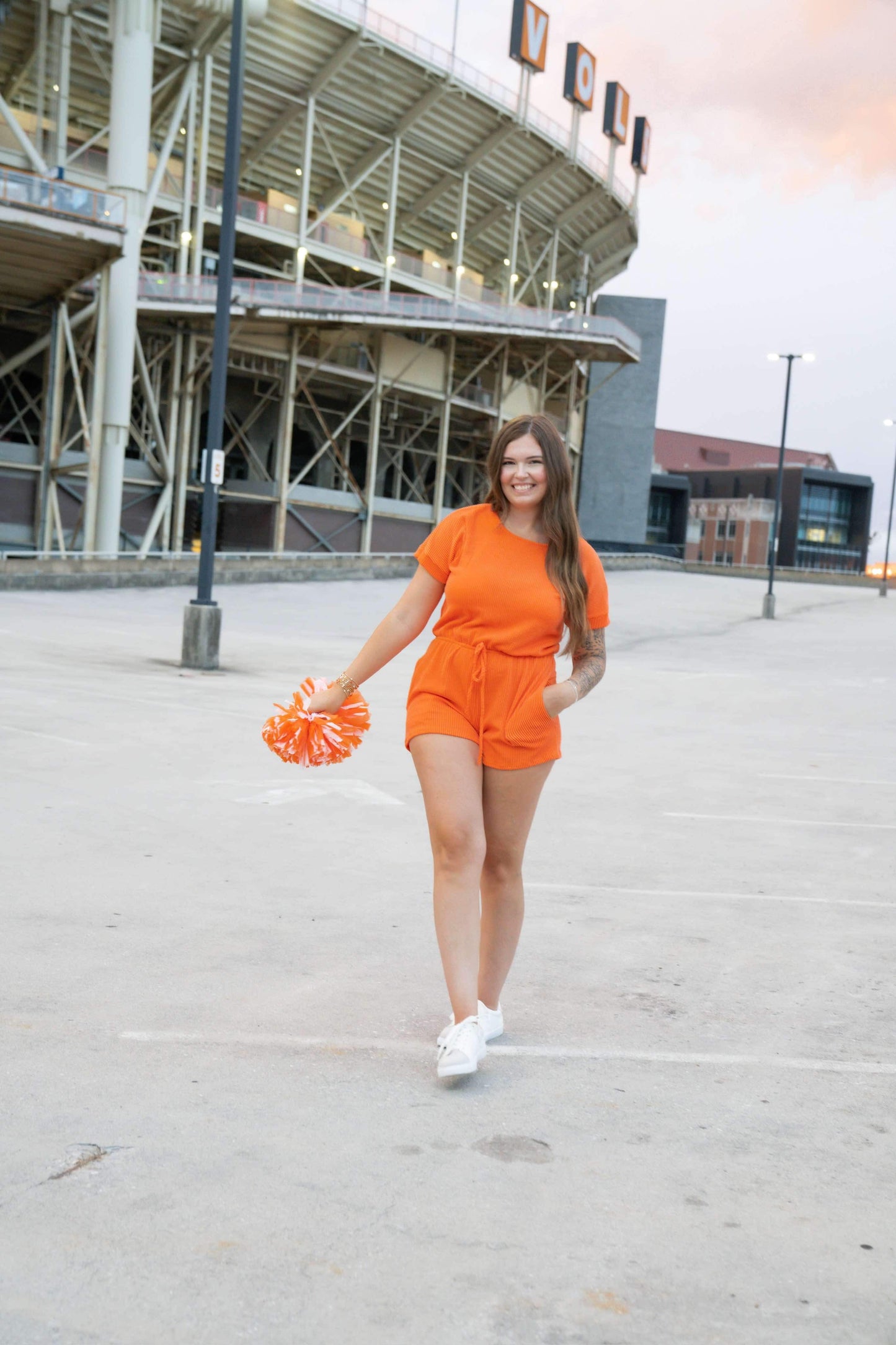 Short sleeved orange game day corded romper