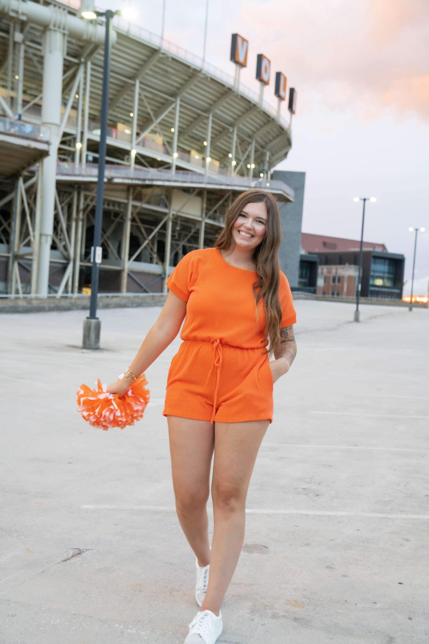 Short sleeved orange game day corded romper