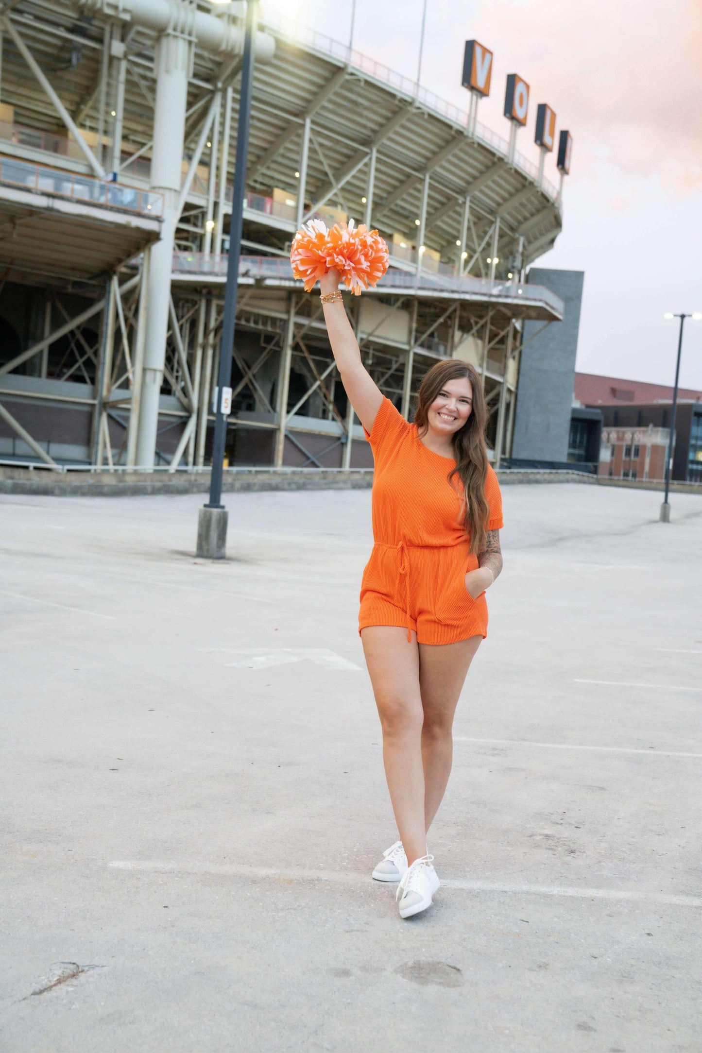 Short sleeved orange game day corded romper