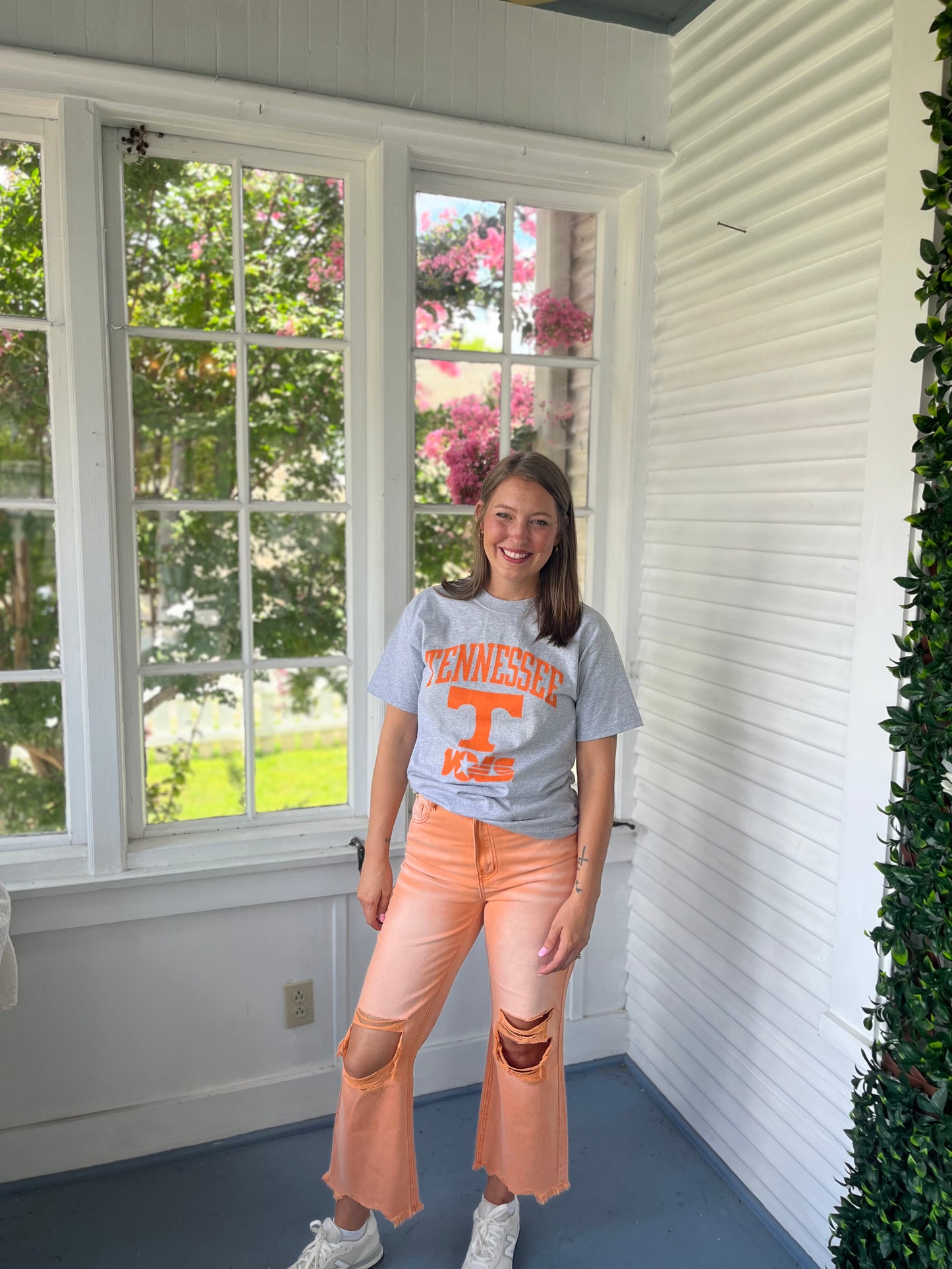 Orange distressed denim pants