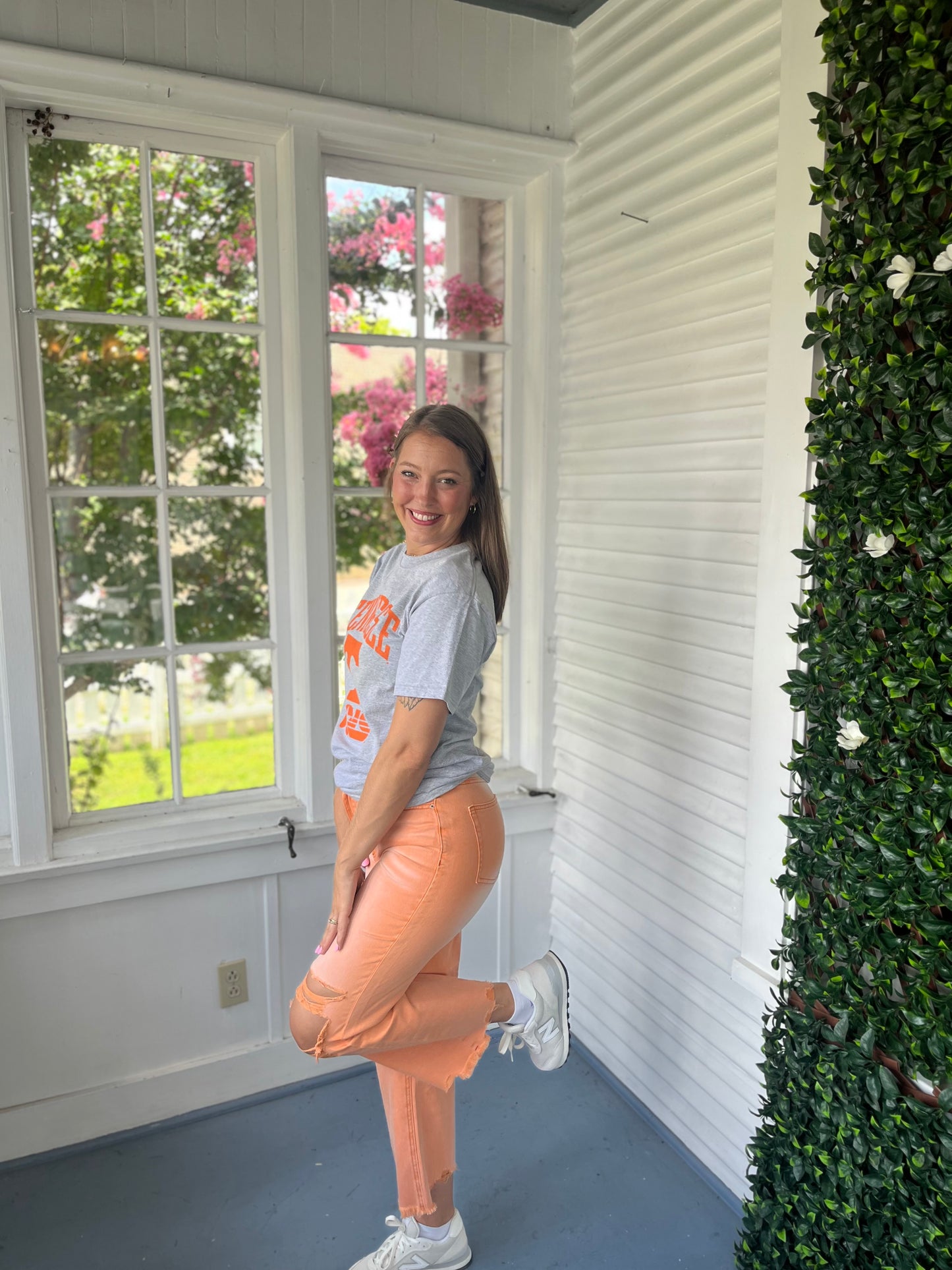 Orange distressed denim pants