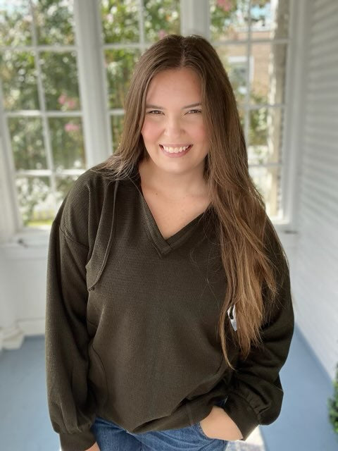 Long sleeved hooded green top