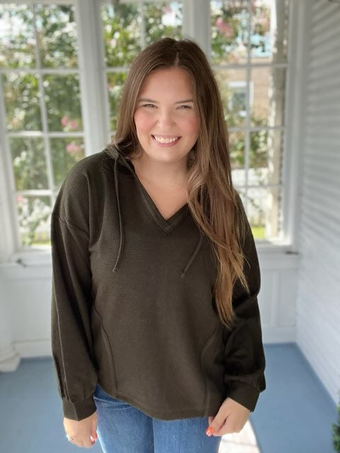 Long sleeved hooded green top